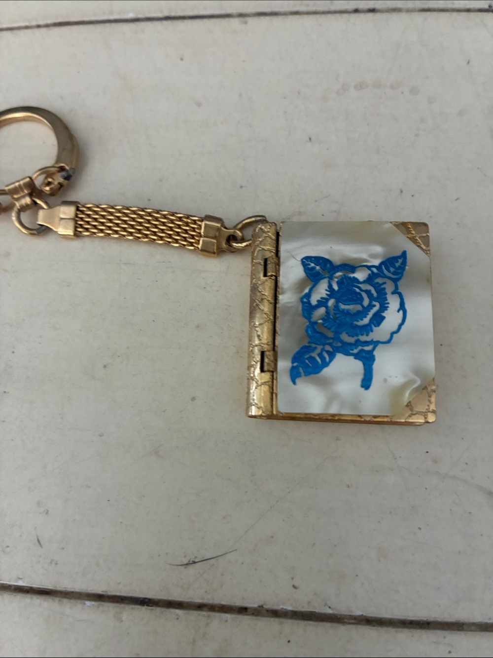 Gold-Tone Mirrored Book Locket Keychain with Blue Floral Detail